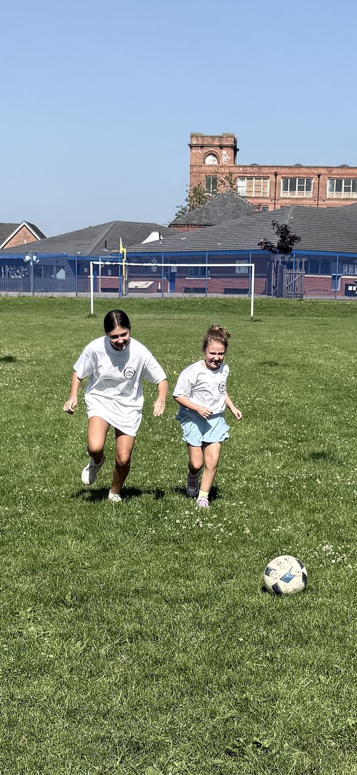 Two players running and smiling together during a session